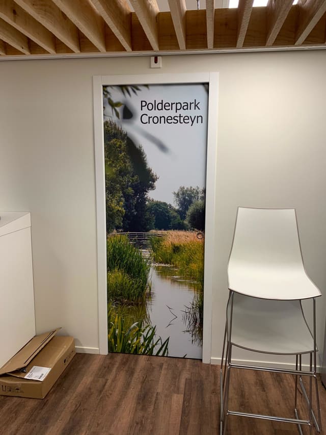 Deur met een fotoprint van een polderlandschap